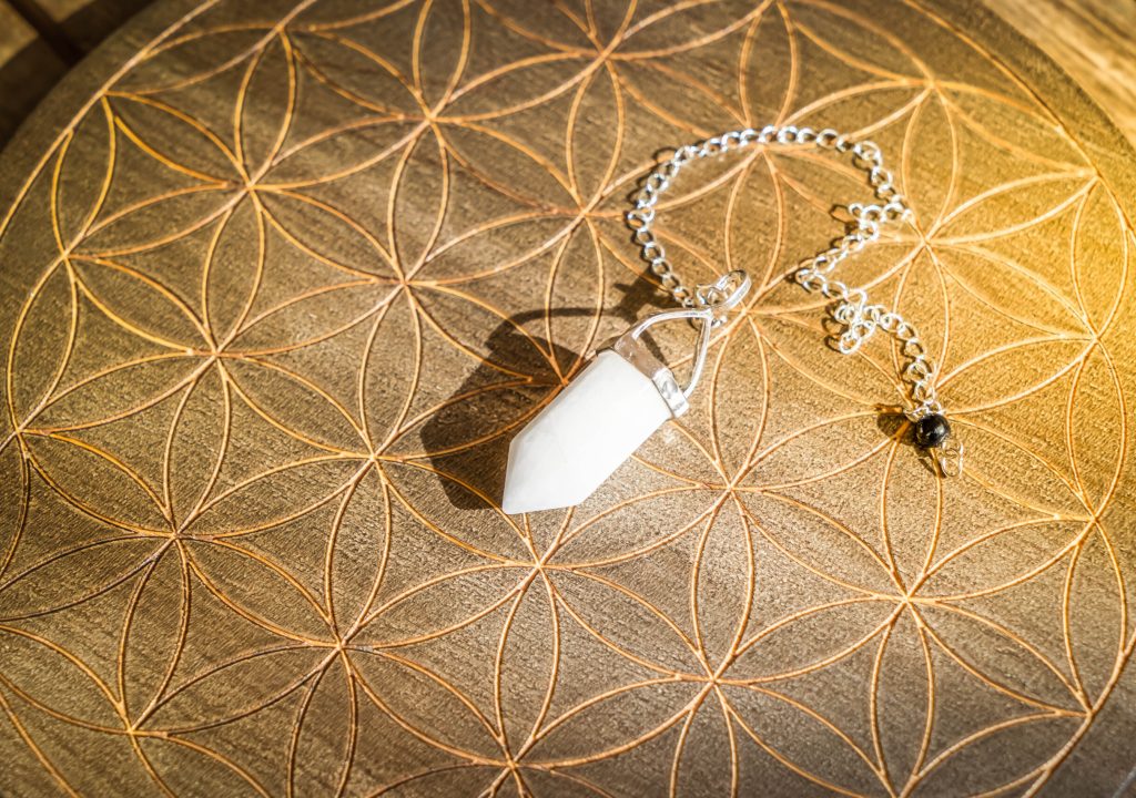Gemstone pendulum. Magic healing Rock for Reiki Crystal Ritual, Witchcraft, spiritual esoteric practice